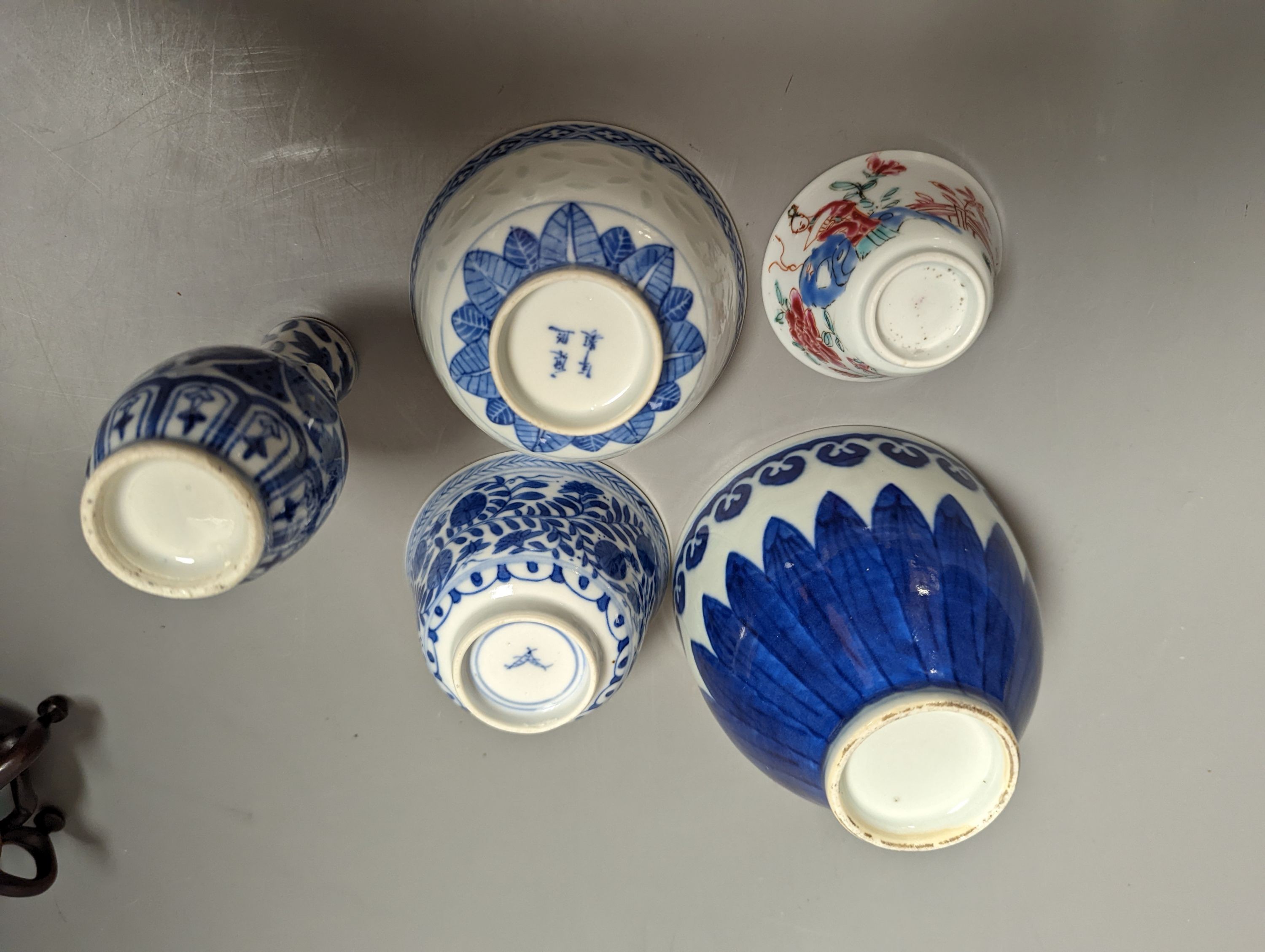 A Chinese blue and white bowl on stand, two tea bowls, miniature vase and an enamelled bowl, 18th-20th century